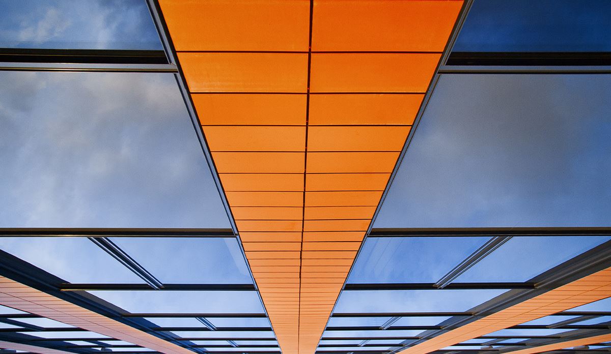Upwards view of a modern glass building.