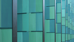 Blue-green glass facade with metal frames