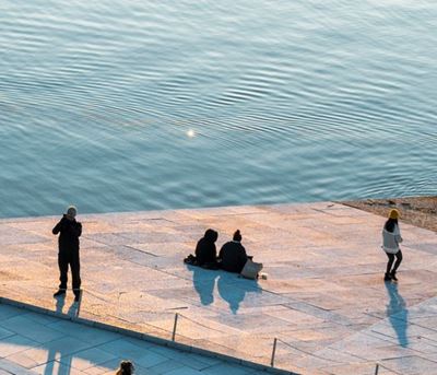 People across the river front