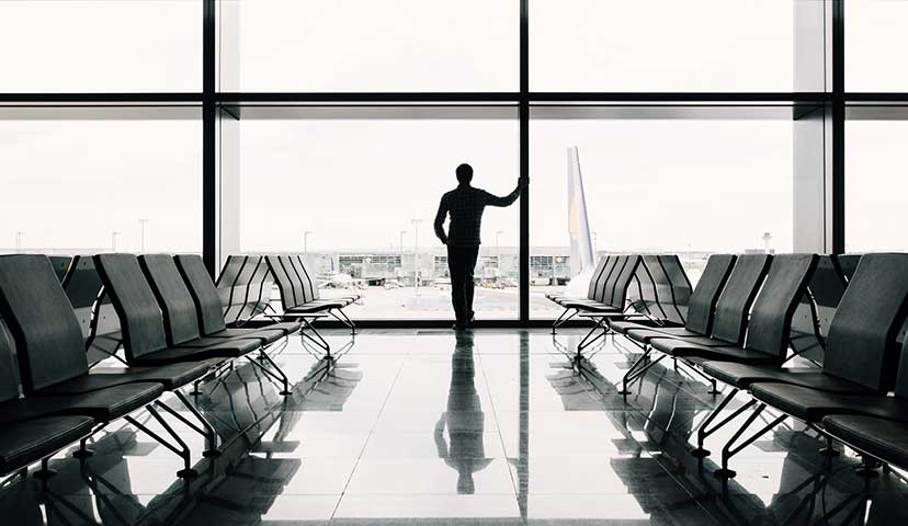 guy standing at window