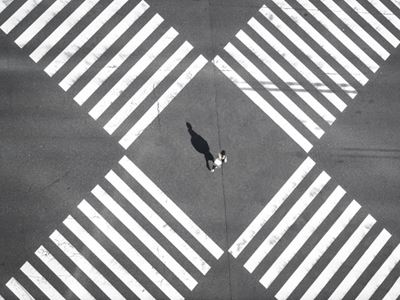 A person standing between crossroads.