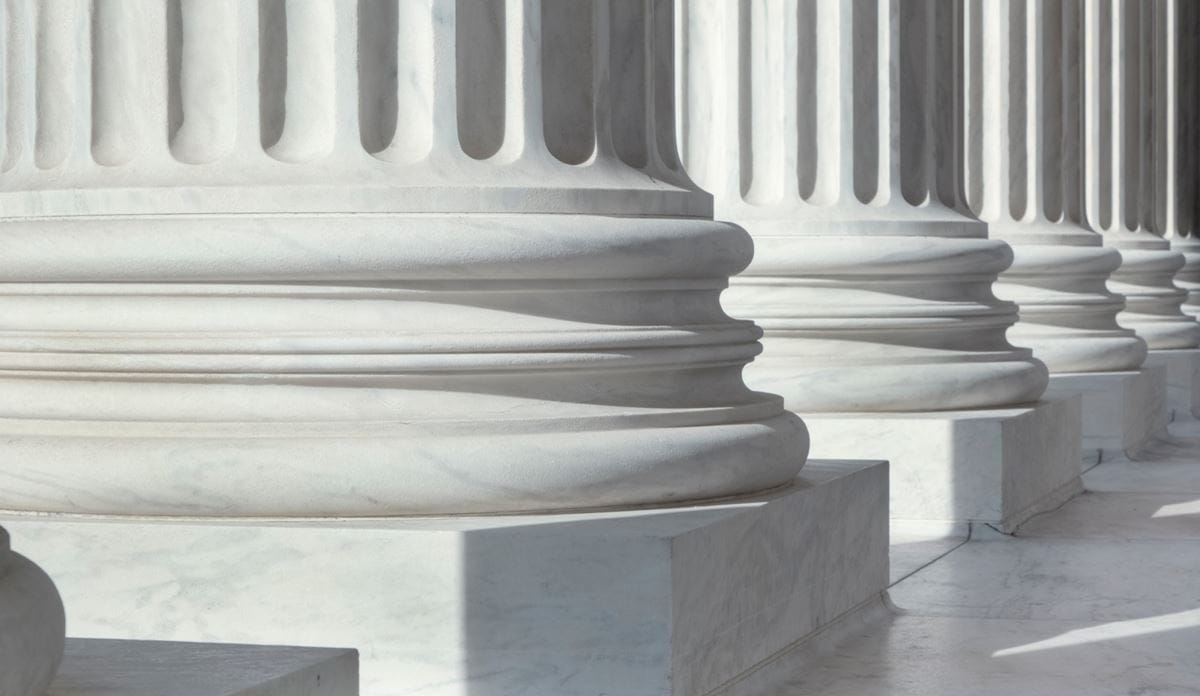 Close-up of stone columns.
