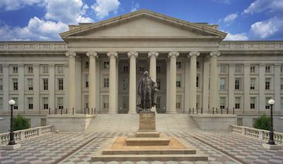 Front view of a large neoclassical government building with tall columns.