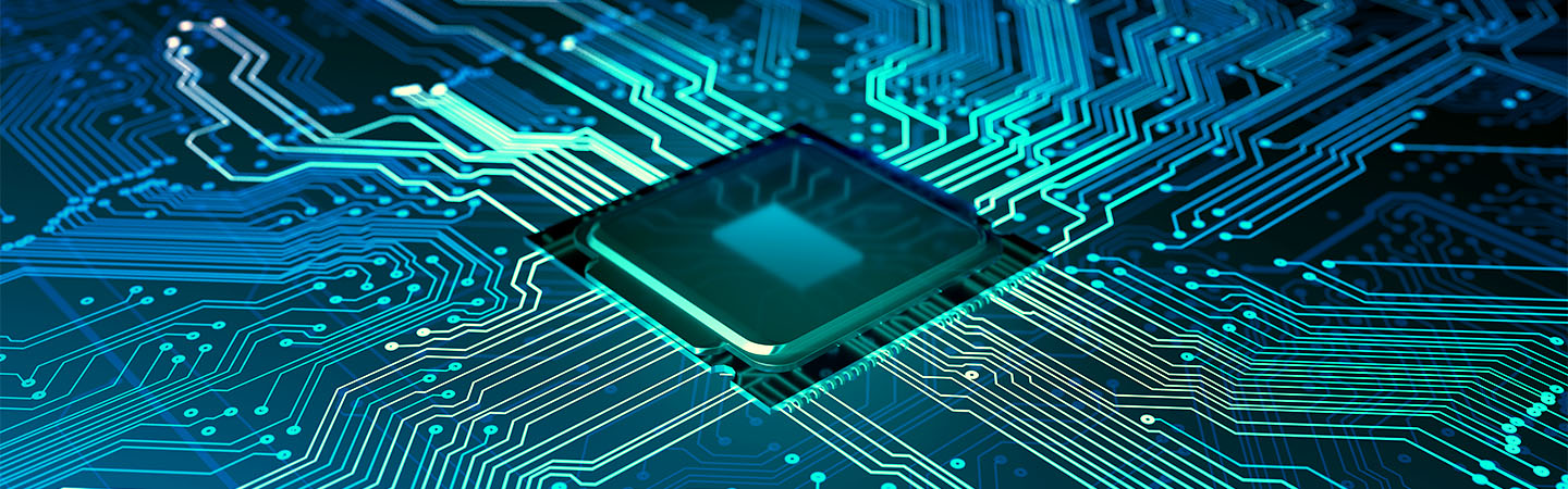 A close-up of a computer chip mounted on a green circuit board, showcasing intricate connections and components.