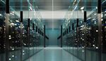 A spacious data center hallway filled with rows of servers