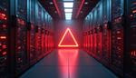 Neon red triangle glowing at the end of a red-lit server room aisle.