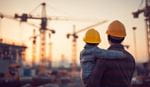 A man and child in construction site