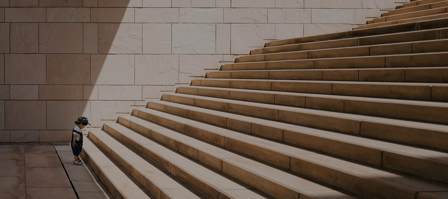 Child looking up the steps