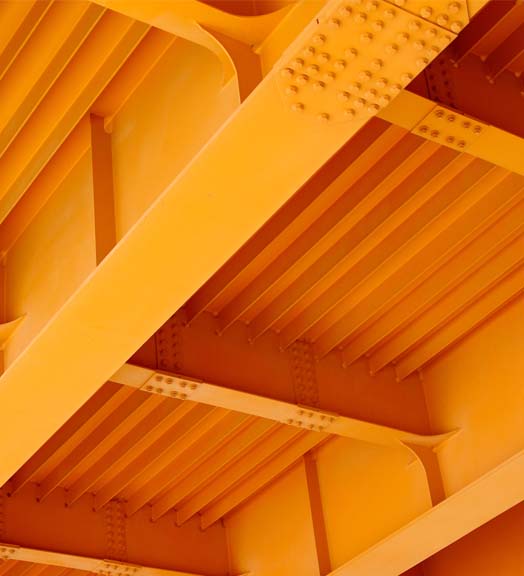 View of a bridge's underside showcasing multiple orange beams