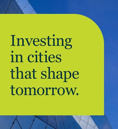 Banner with the text investing in cities that shape tomorrow.