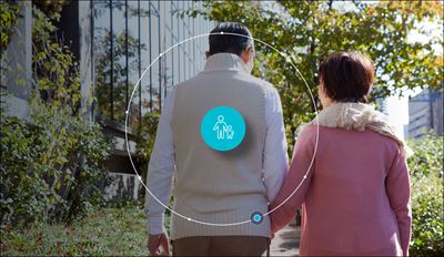 Two older adults walking