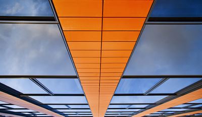 Upwards view of a modern glass building.
