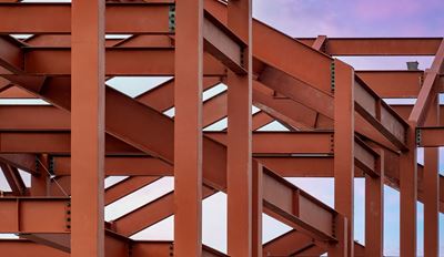 Steel beams forming a structural framework of a building under construction