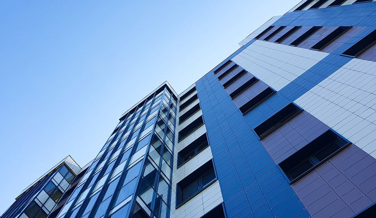 Glass building with view of sky.