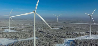 Wind farm standing over trees