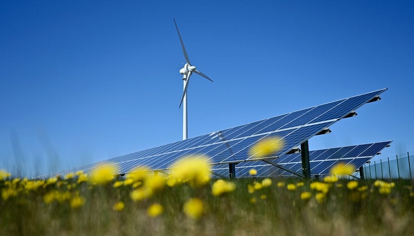 Windmill over a solar panel