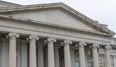 Treasury Department building with columns and pediment.