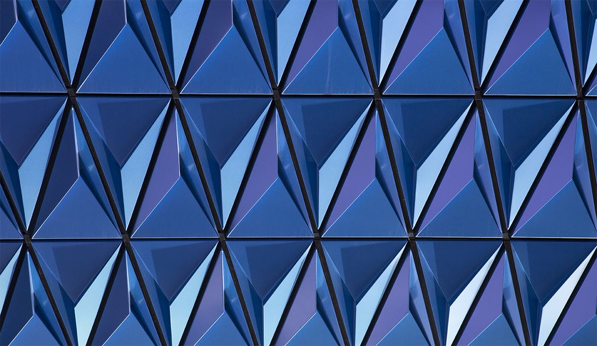 A blue structure adorned with prominent triangular designs