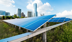 Solar panels on elevated structures overlook a city skyline