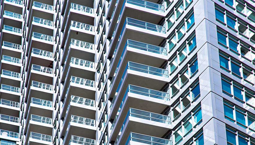 Close up image of tall apartment block