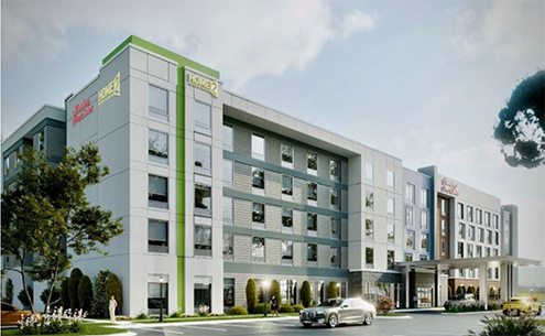Exterior view of the Holiday Inn hotel, showcasing its modern architecture and welcoming entrance.