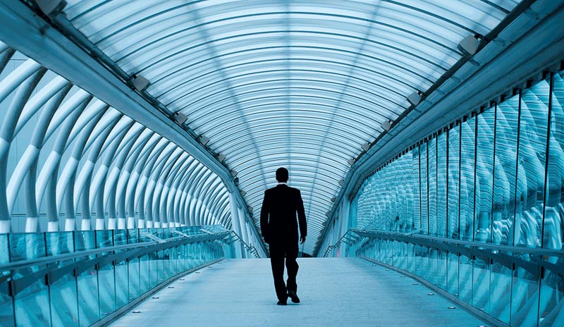 Man walking on the covered bridge