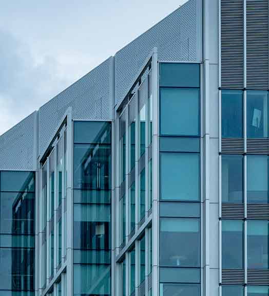 The side of a glass and steel building